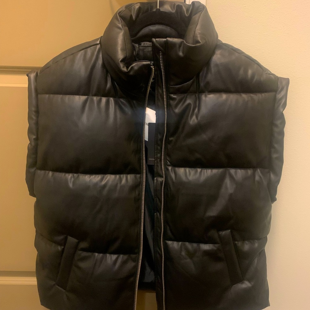 Black, oversized, faux leather vest. Brand new with tags. Never worn!